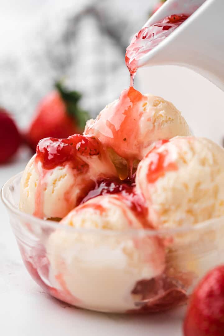 strawberry syrup topped on ice cream.