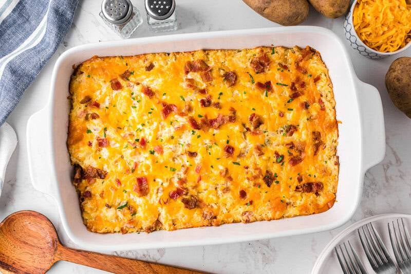 baked crack potatoes hashbrown casserole with golden melted cheese and bacon on top