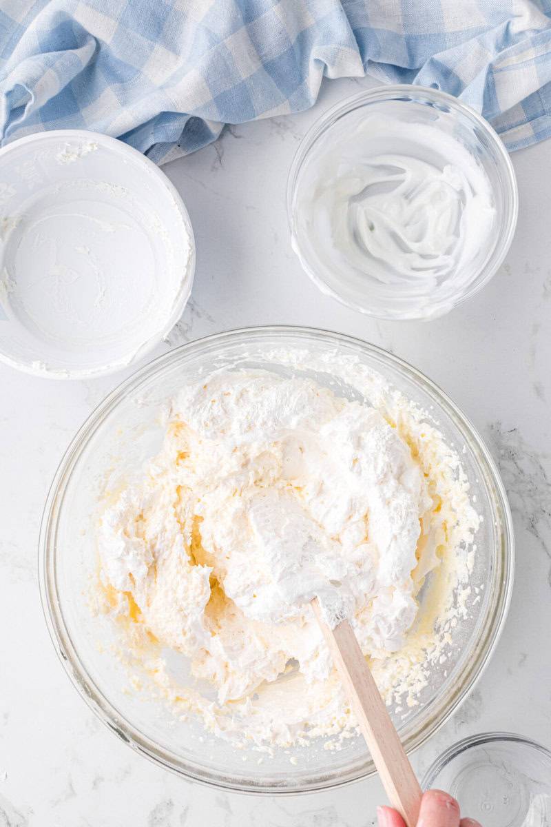 mixing the pudding mix and Greek yogurt in with the cream cheese.