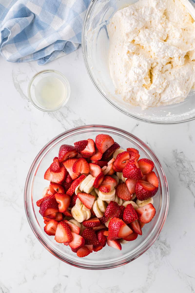 bowl of sliced strawberries and bananas to mix in with the cheesecake filling.