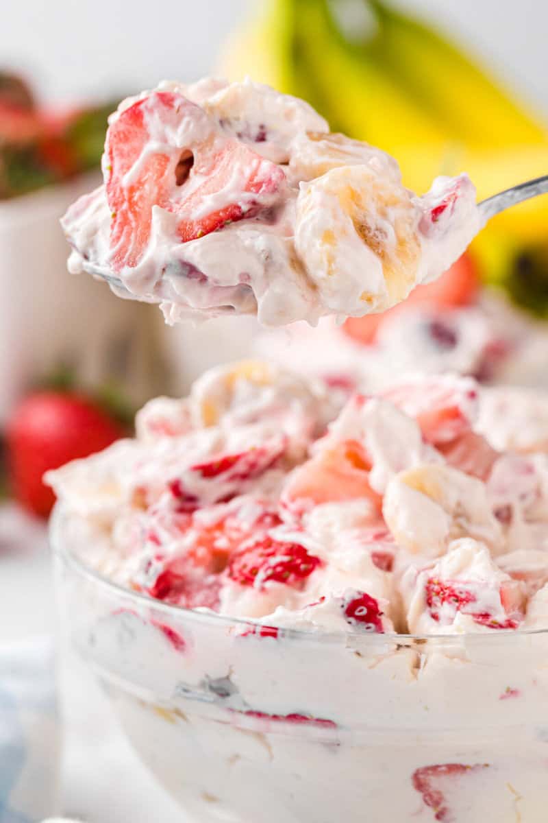 serving the Cheesecake Salad with a metal spoon.