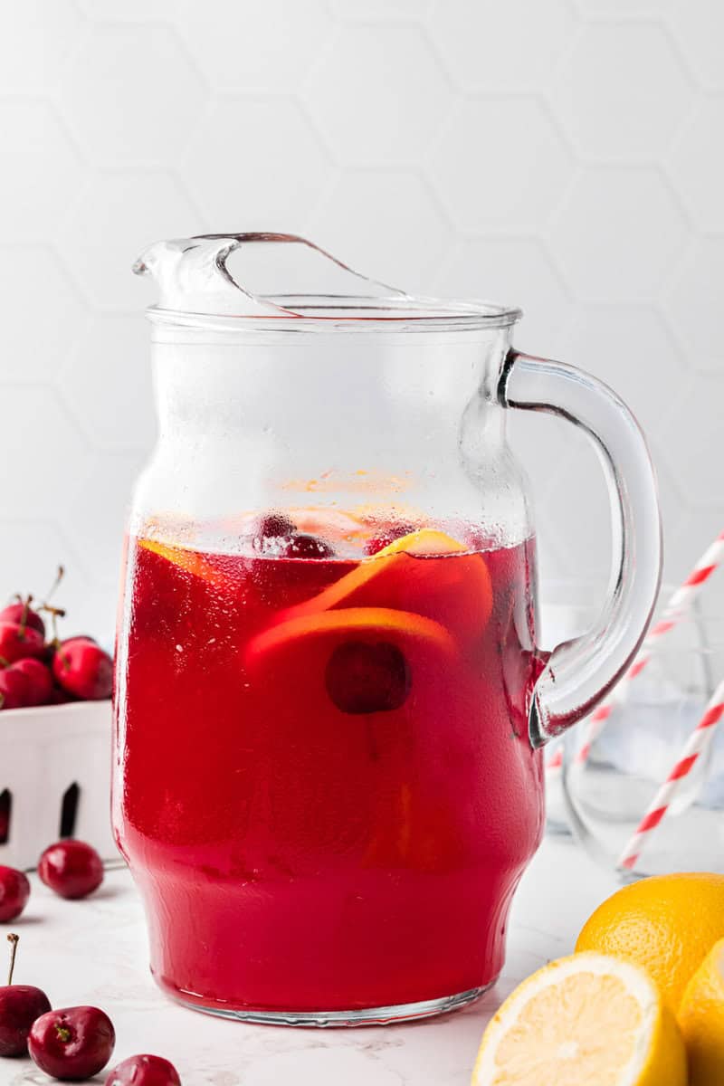 Cherry Lemonade in a glass pitcher.