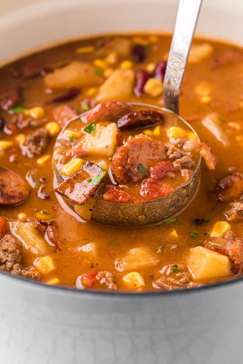 serving the Cowboy Stew with a metal ladle. 
