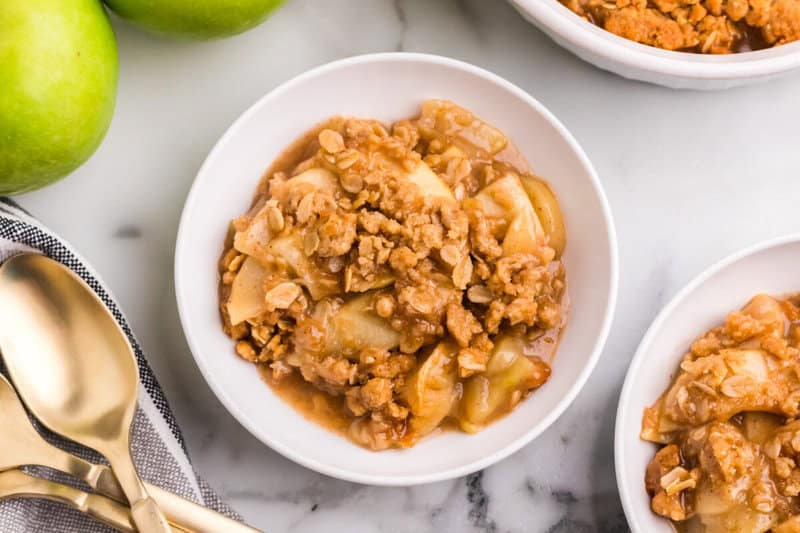 Apple Crisp served in white bowls.
