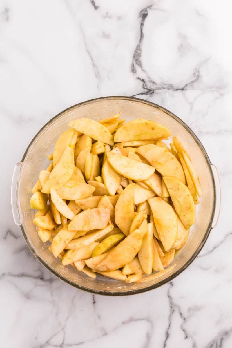 sliced apples tossed in the seasoning to make the apple filling.