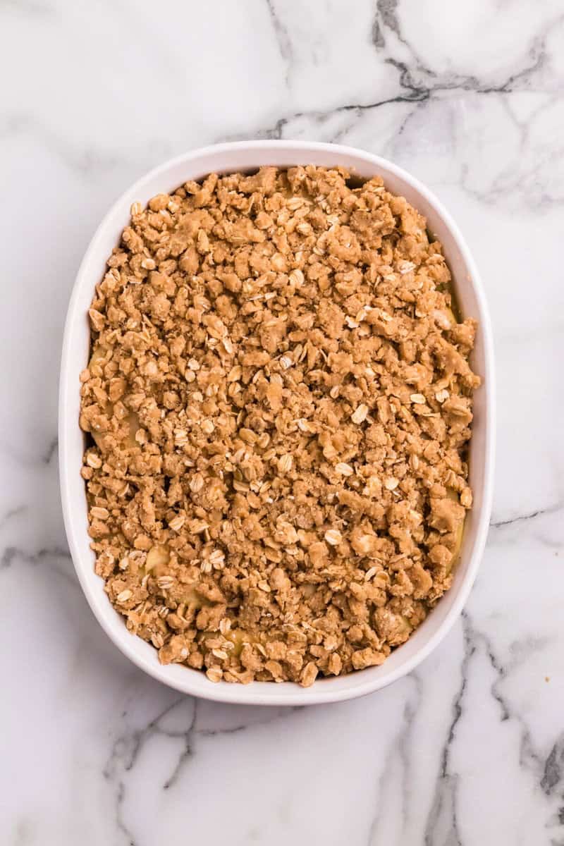 apple crisp in white baking dish.