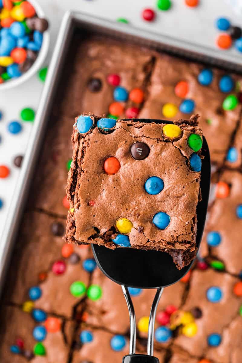 serving the brownies with a spatula.