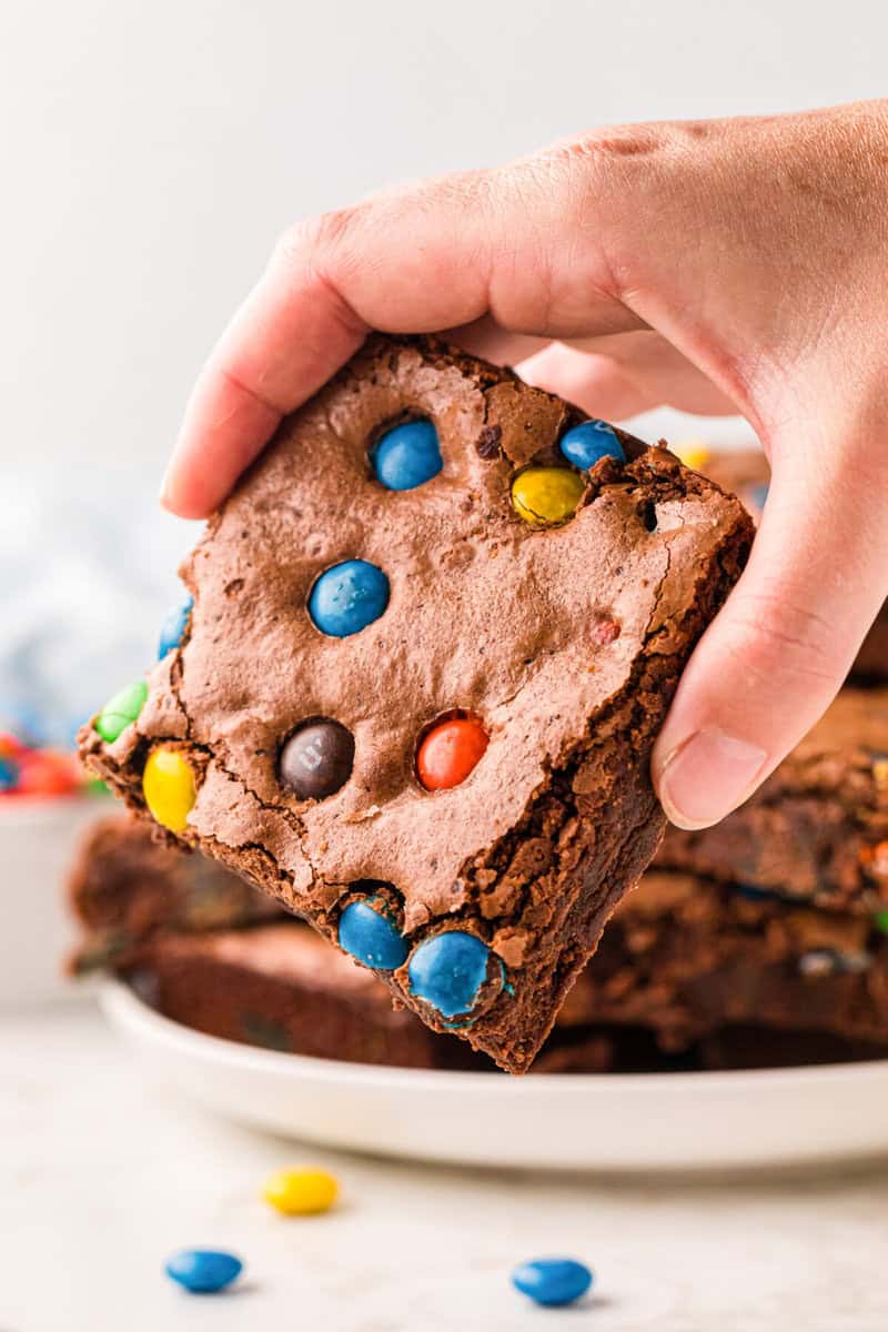 closeup of M&M Brownie in hand.