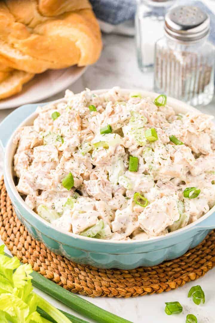closeup of rotisserie chicken salad in blue serving dish.