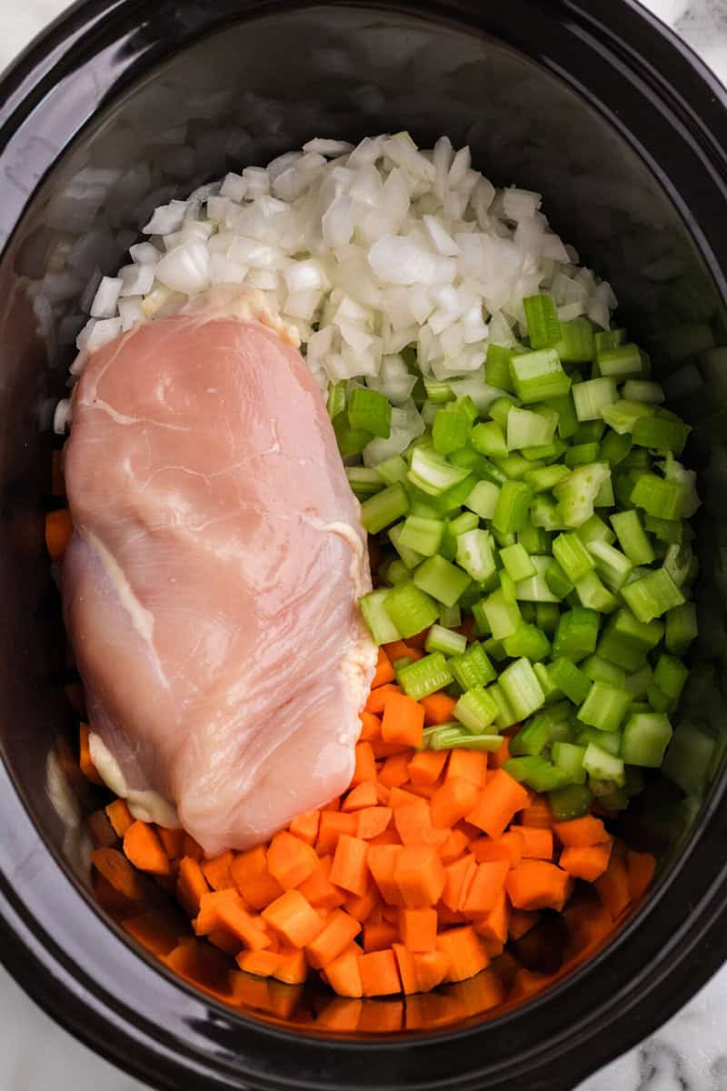 ingredients in the bottom of the slow cooker.