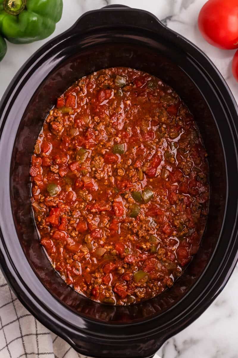 all ingredients for the sauce mixed up in the slow cooker.