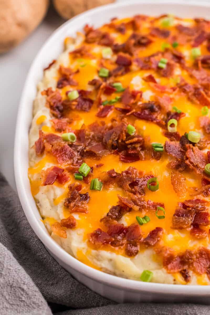 closeup of the twice baked mashed potatoes in the baking dish.