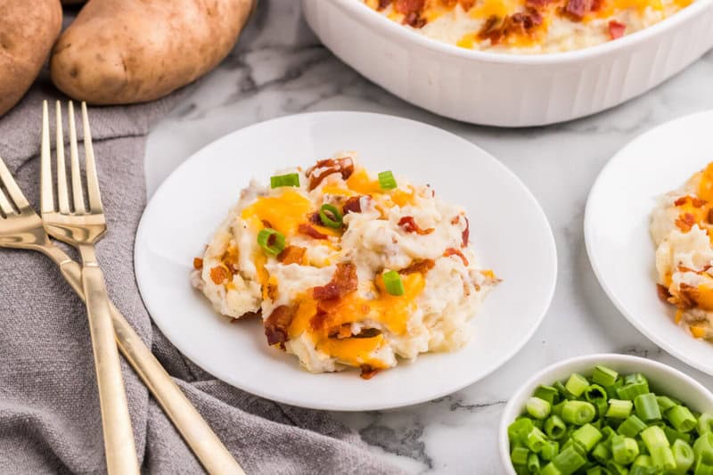 twice baked mashed potatoes served on white plate.