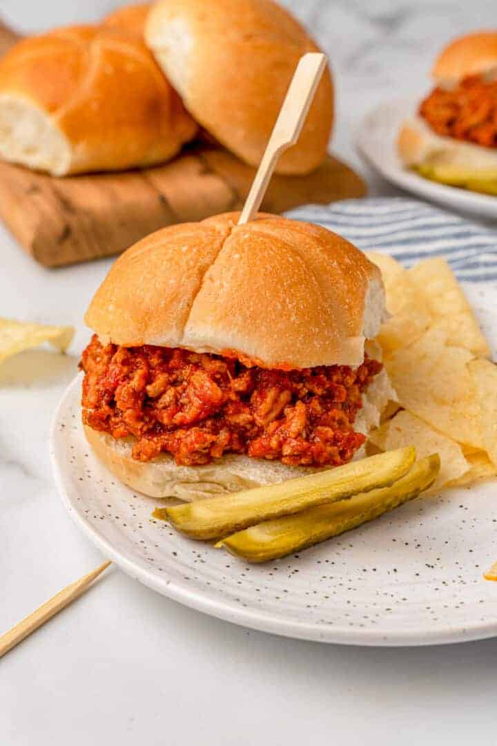 Ground Turkey Sloppy Joes served with chips and pickles.