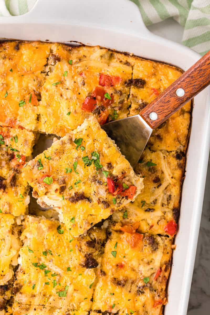 top-down view of serving a slice of the breakfast casserole.