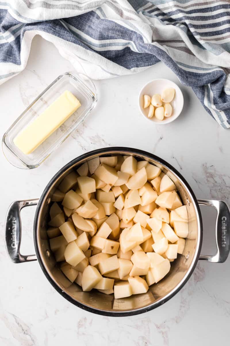 potatoes in large pot to boil.