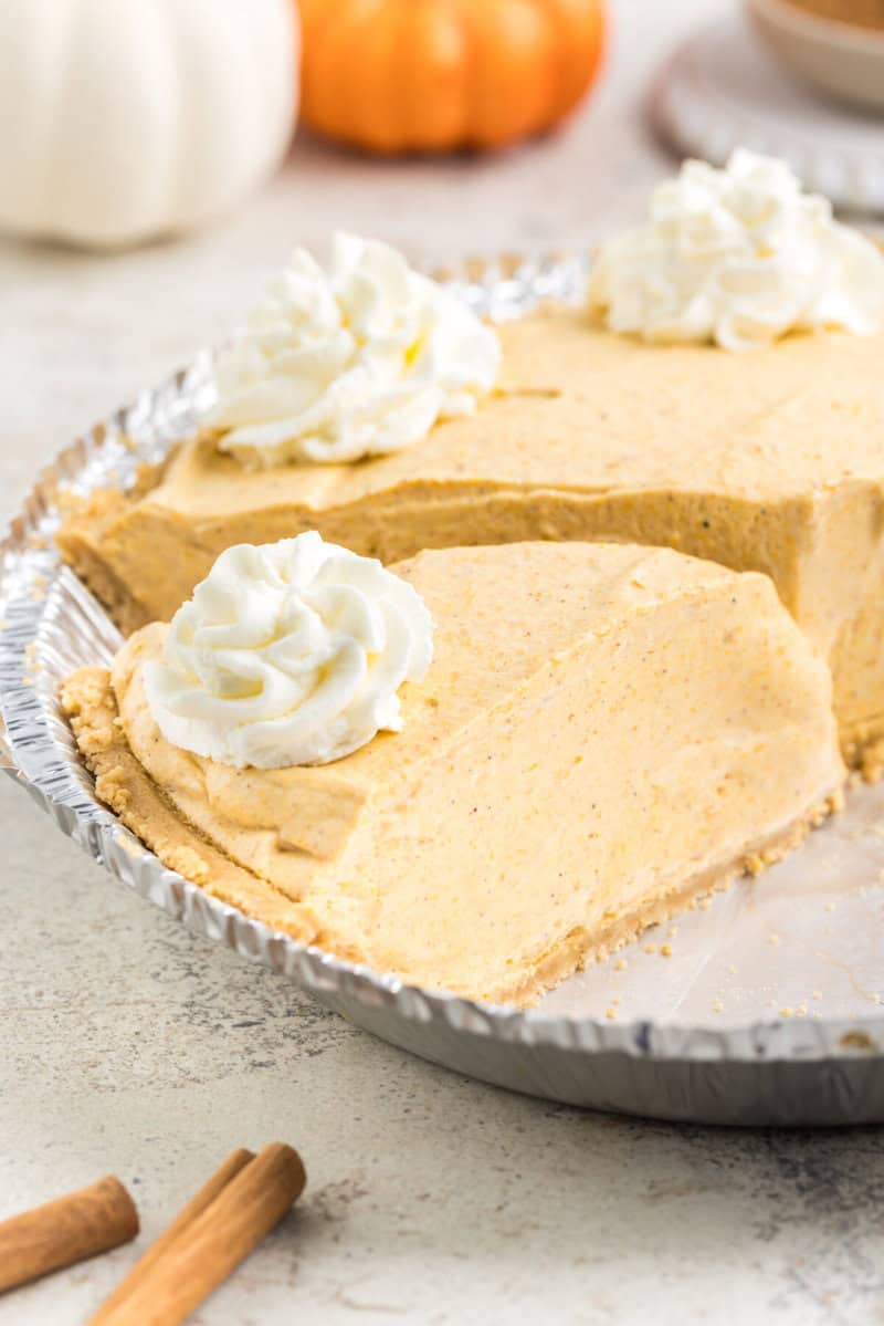 closeup of a slice of the pumpkin pie in the pie tin.