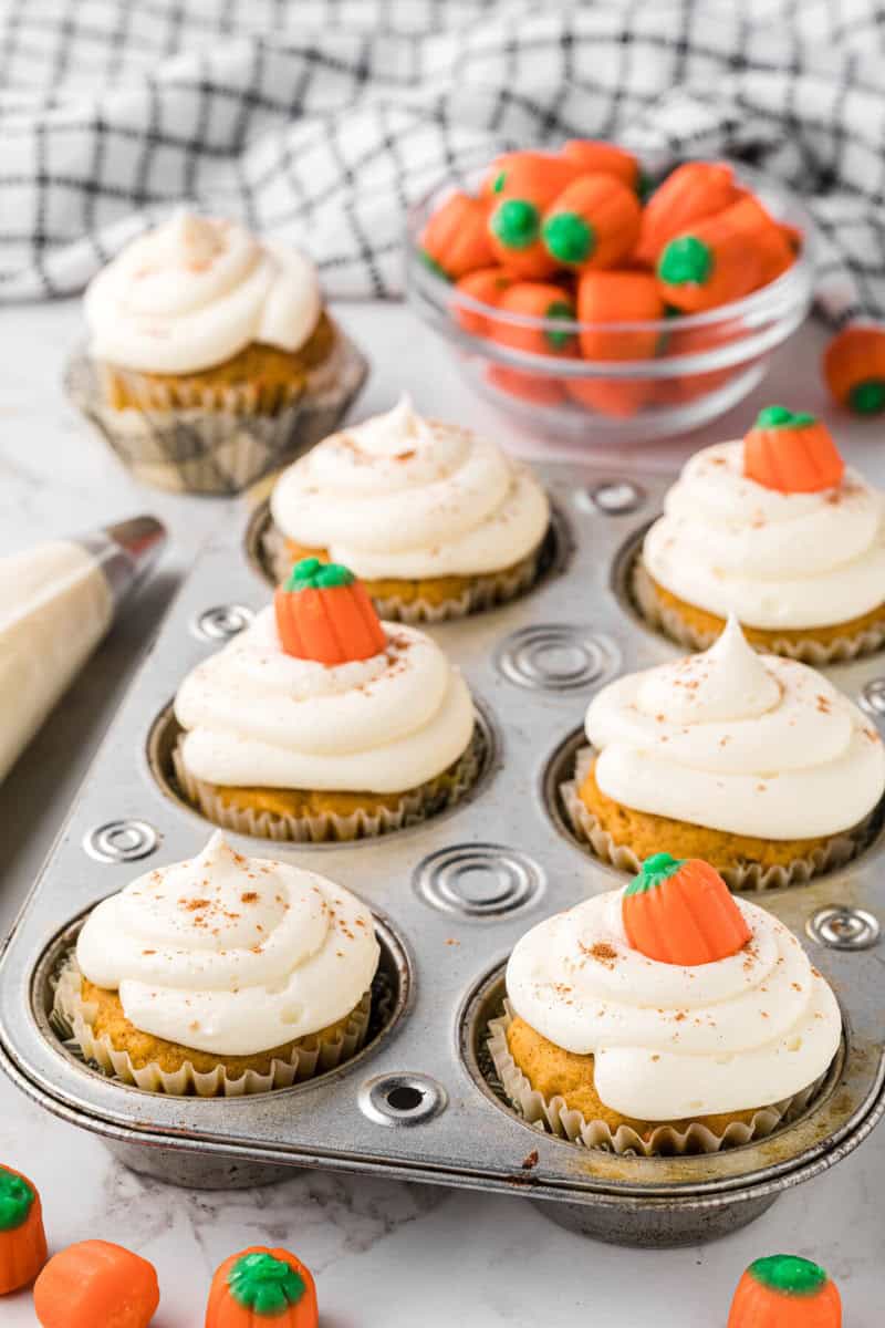 closeup of the decorated pumpkin cupcakes.
