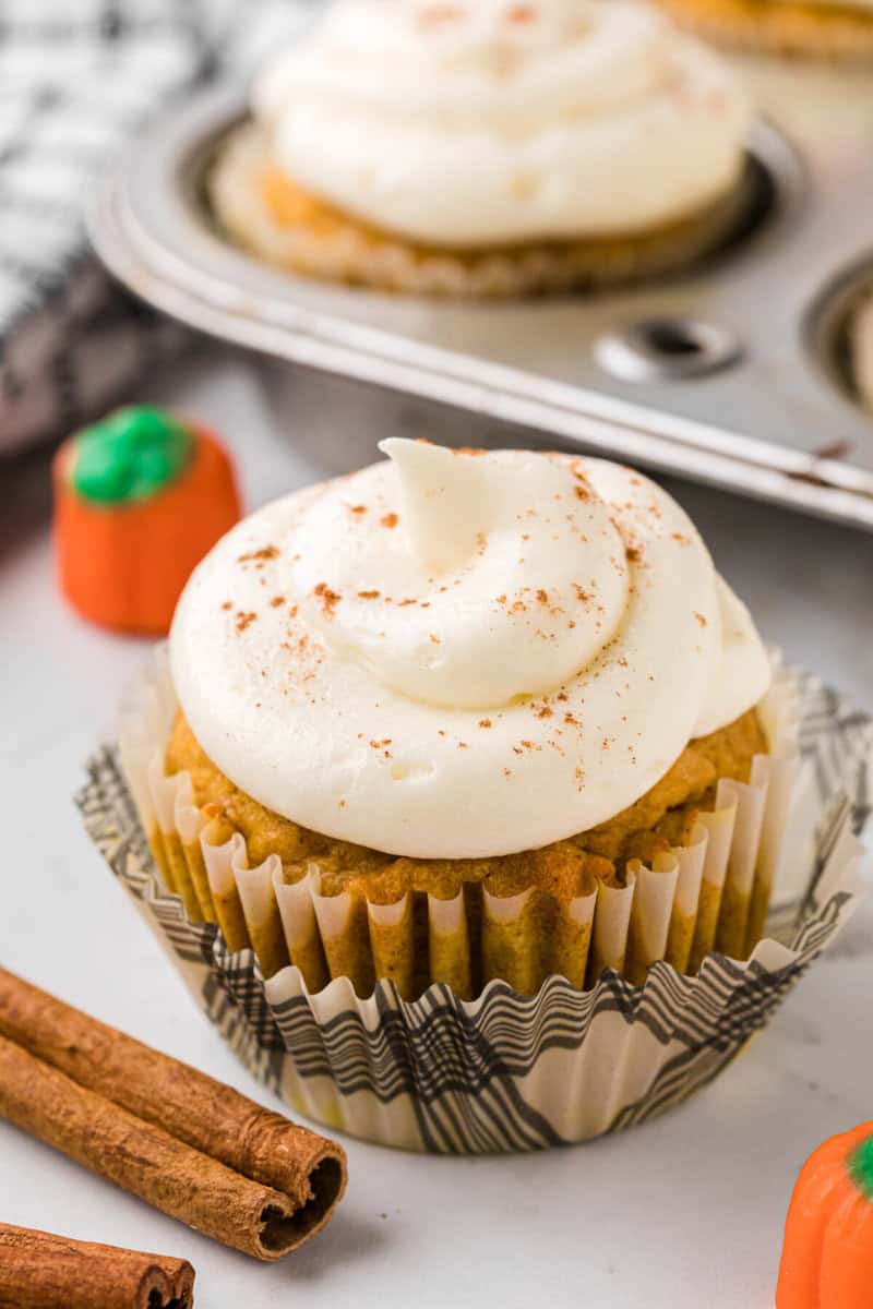 closeup of a finished and decorated pumpkin cupcake.
