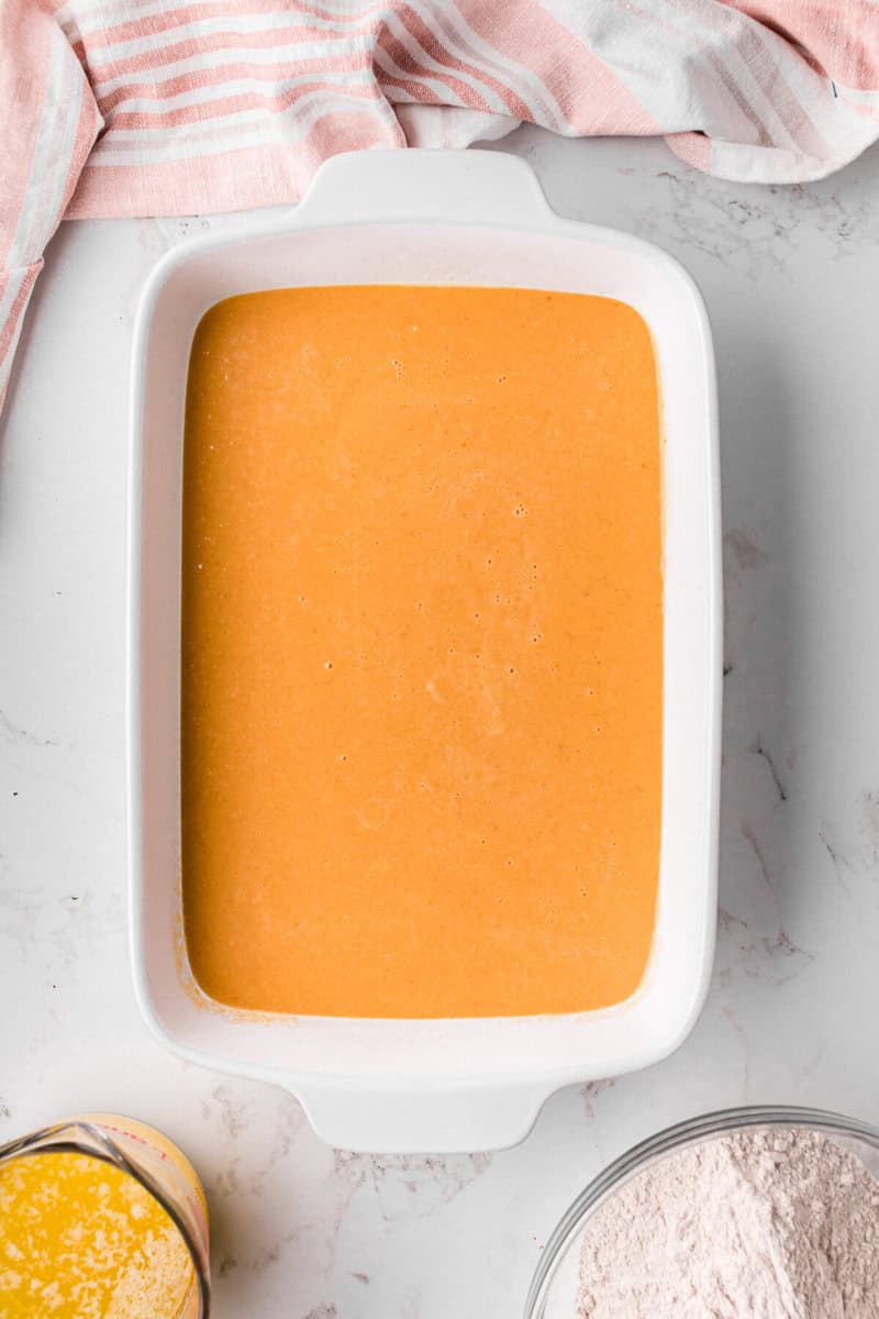 the pumpkin batter in the bottom of the cake pan.
