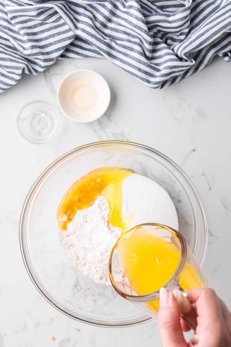 mixing the melted butter with the dry ingredients to make the topping.