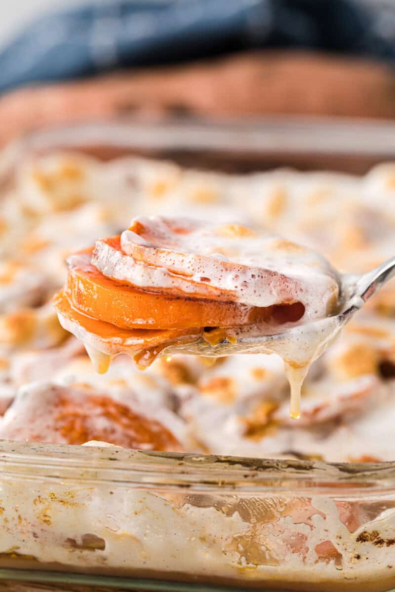 closeup of serving the yams with a metal spoon.