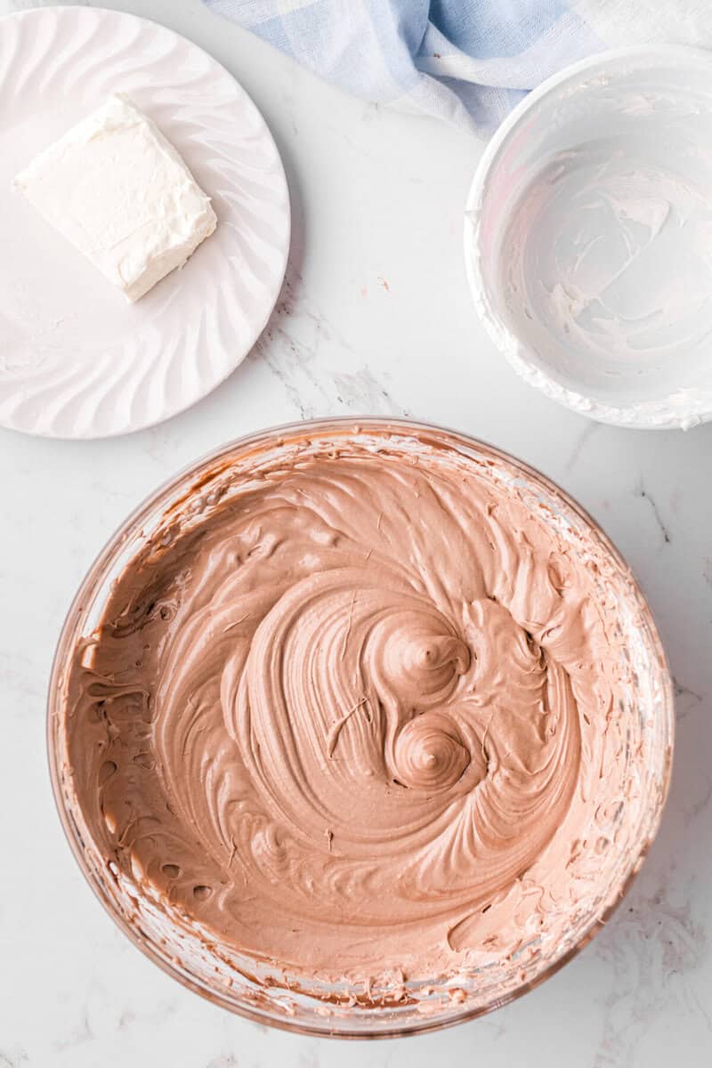 adding the whipped cream to the dip.