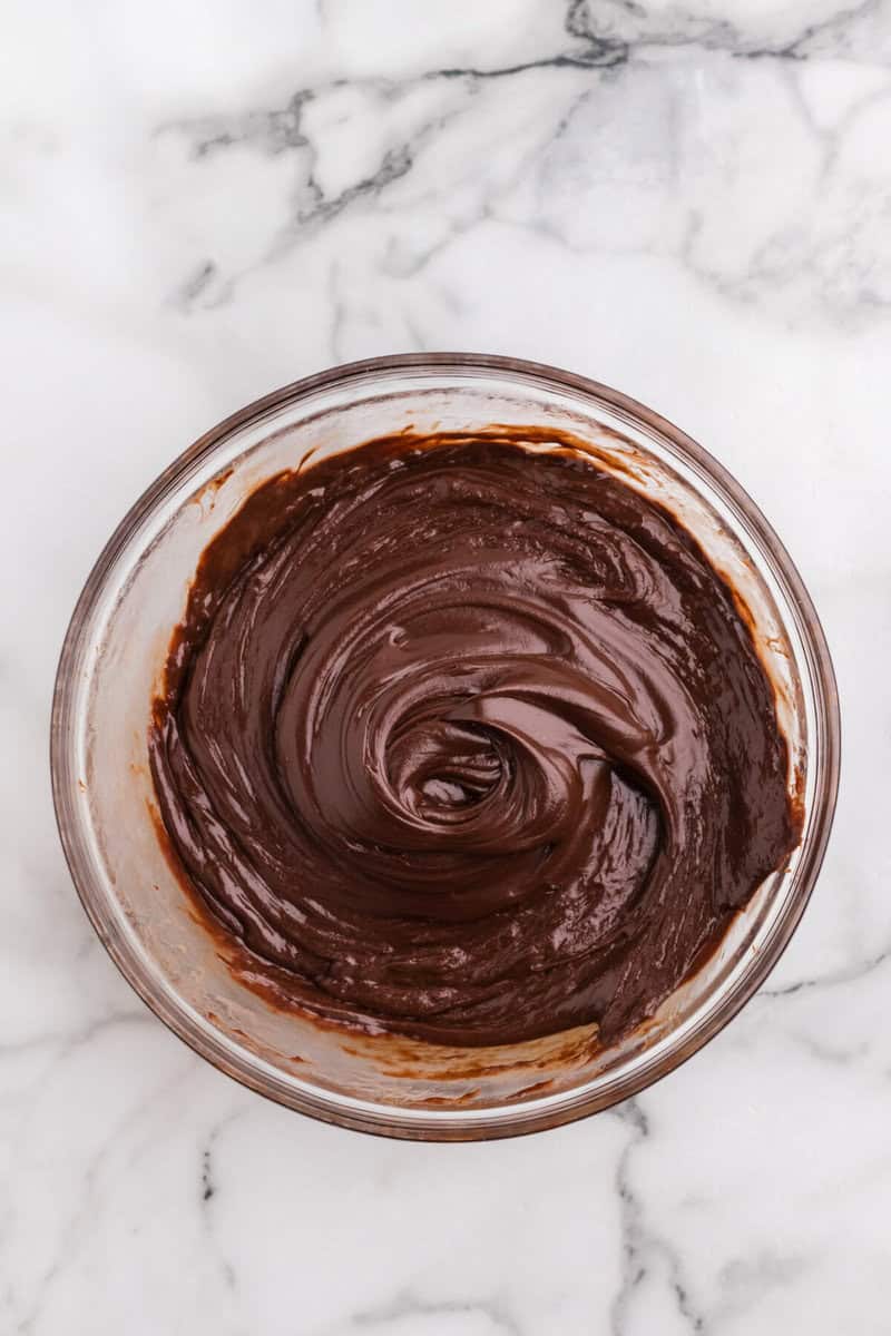 chocolate fudge layer prepared in a large glass bowl.