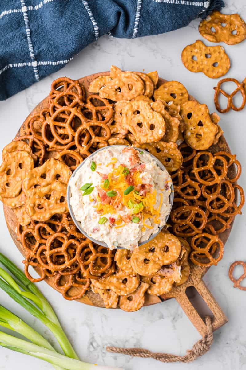 top-down view of the pretzel dip in a bowl surrounded by pretzels.