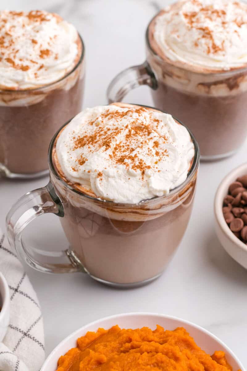 closeup of 3 mugs of hot chocolate.