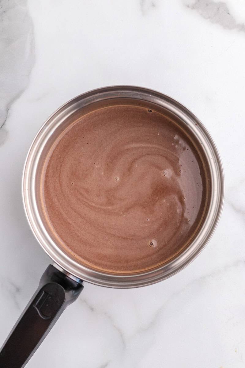 cooking the hot chocolate in a sauce pan.