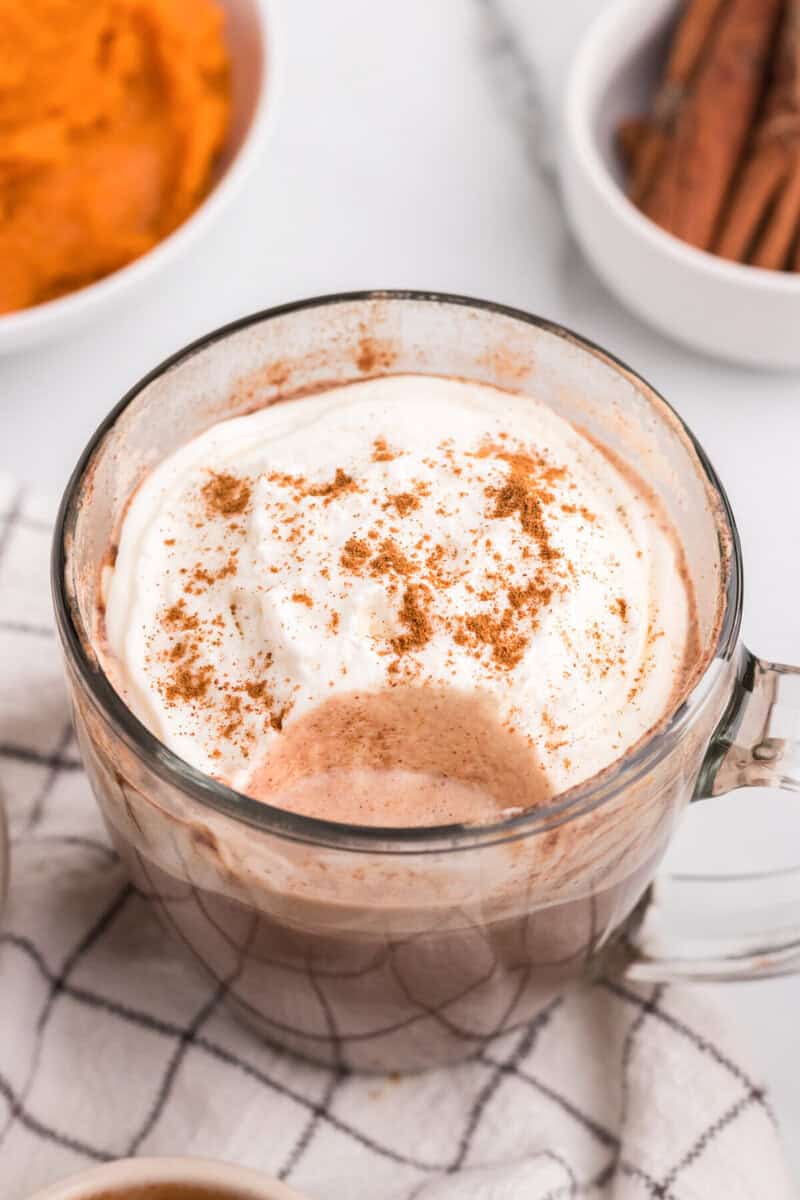 mug of the pumpkin spice hot chocolate with a sip taken out of it.
