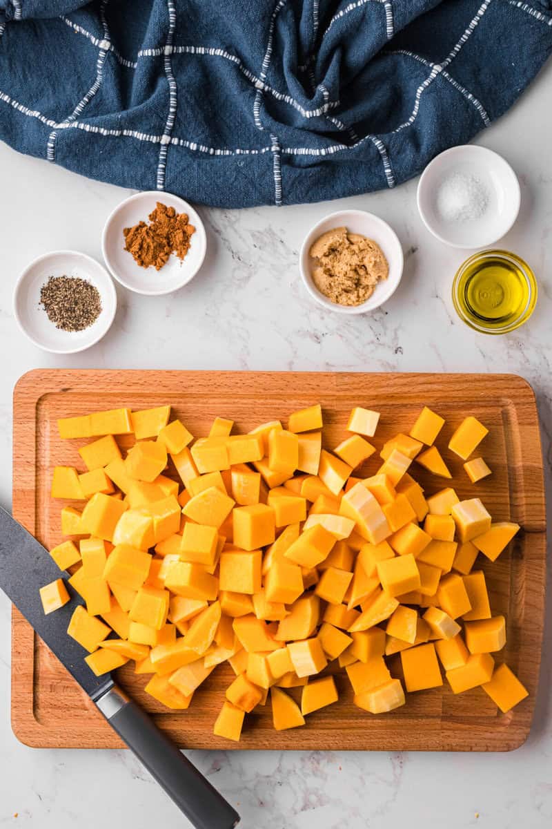 dicing the butternut squash into bite size pieces.