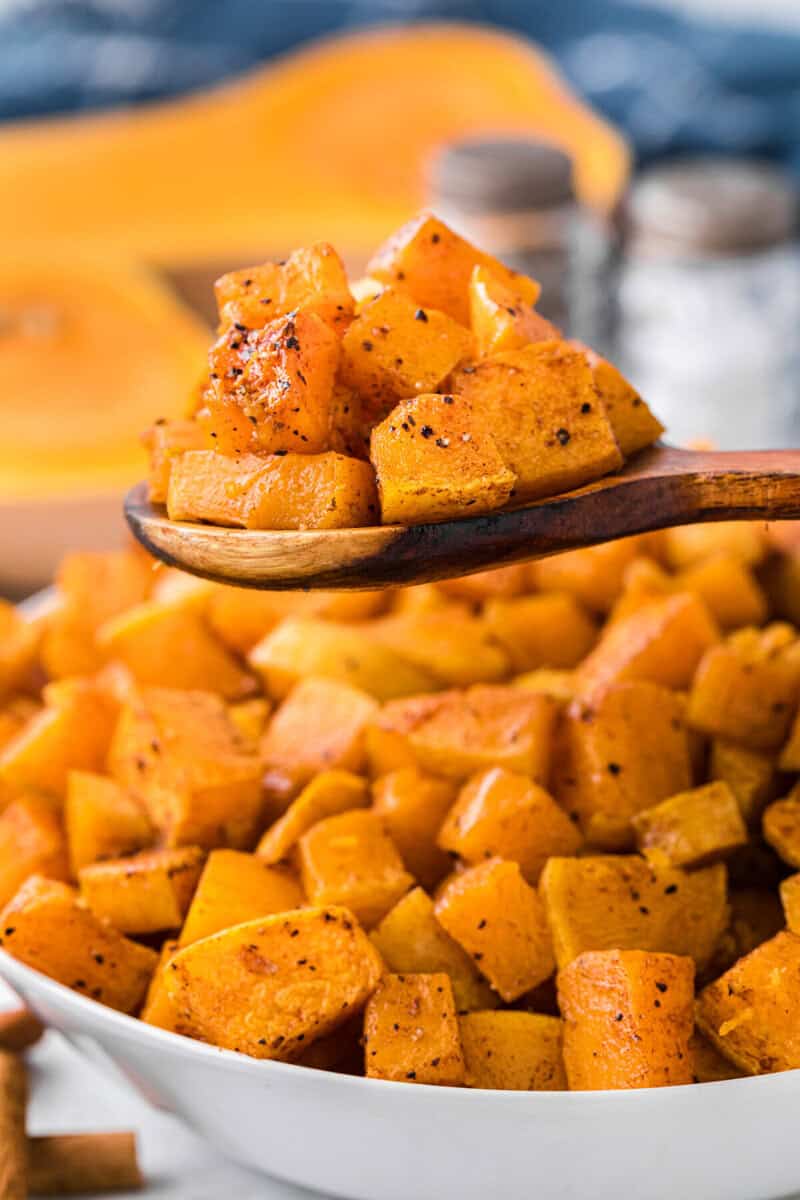 roasted butternut squash on wooden spoon.
