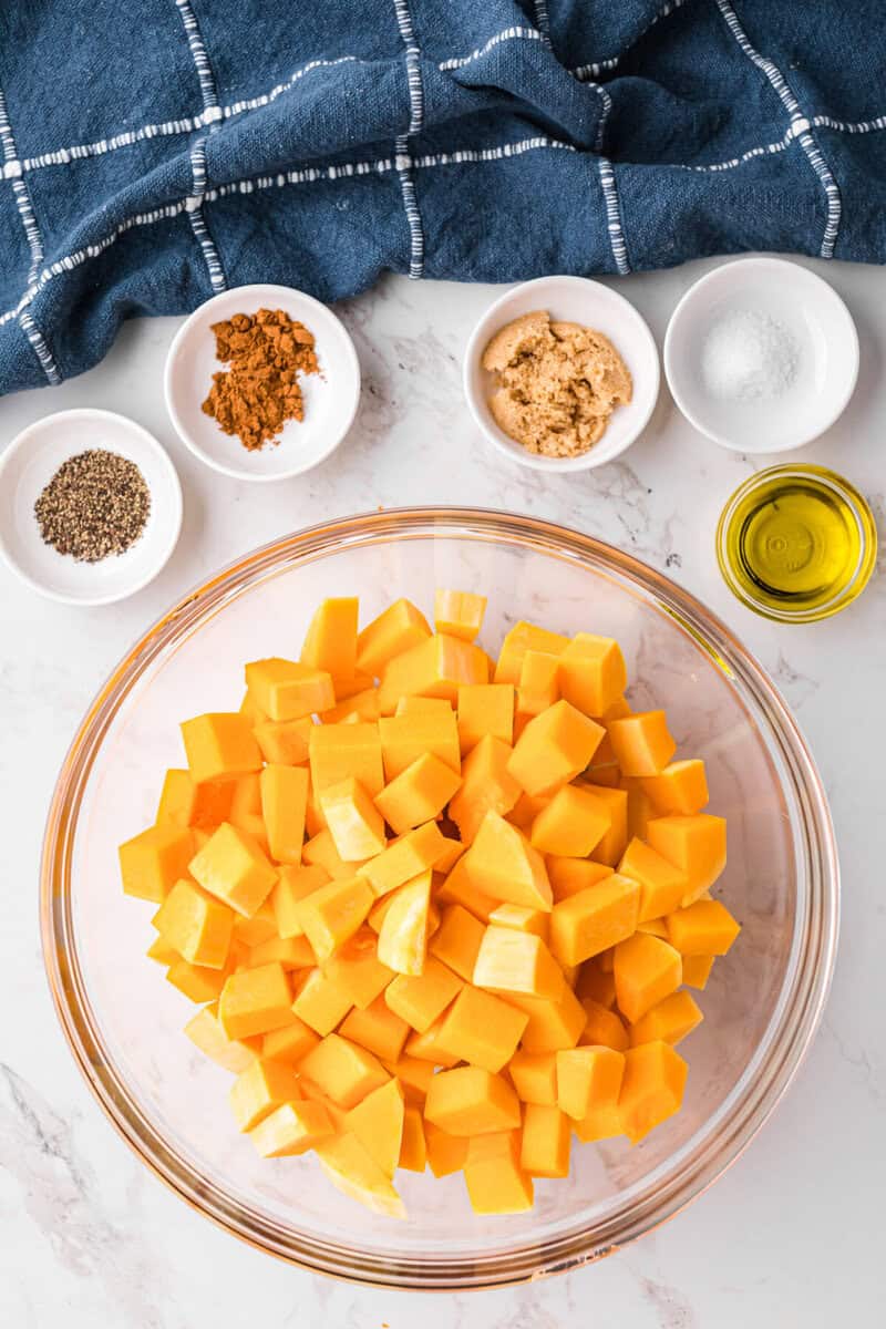 diced butternut squash in a large bowl to be seasoned.