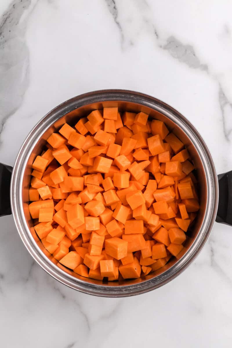 preparing the diced sweet potatoes for boiling.