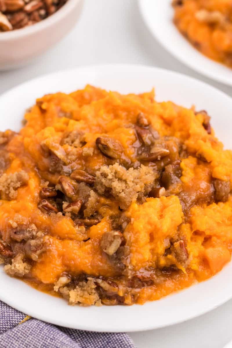 closeup of the sweet potato casserole on a white plate.