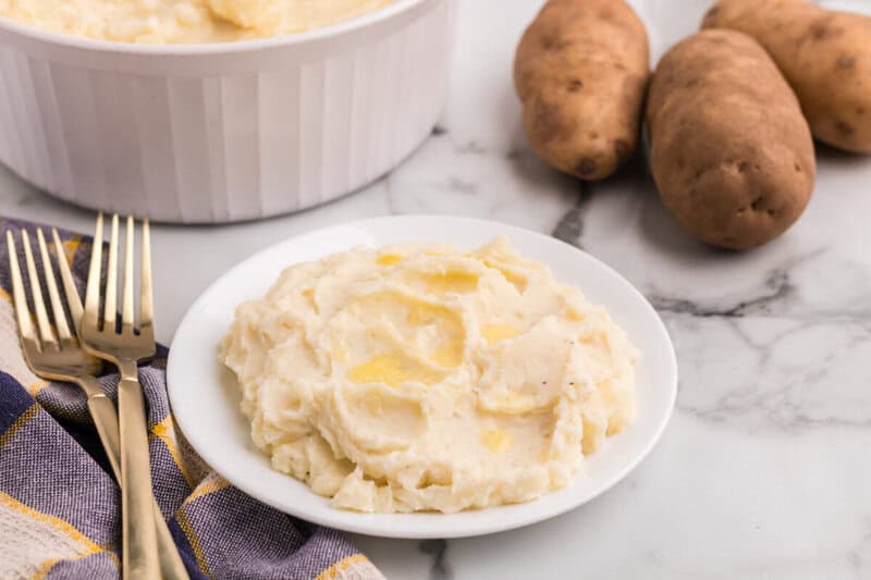 mashed potatoes served on a white plate.