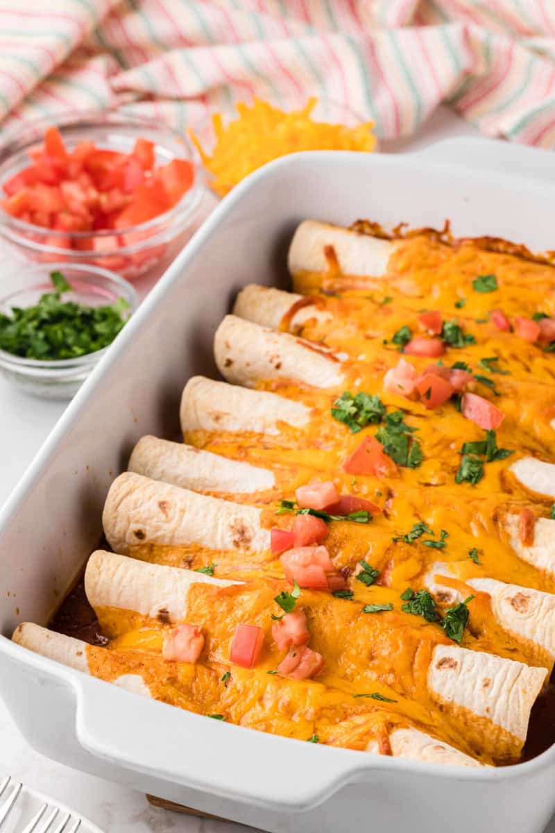 baked enchiladas in the casserole dish.