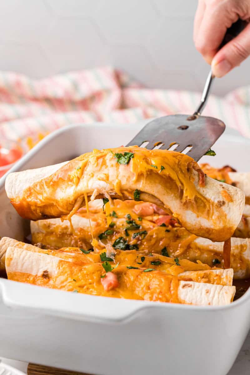 serving the enchiladas out of the casserole dish.