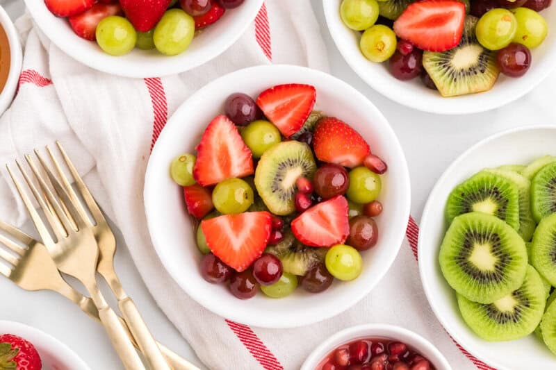 Christmas Fruit Salad served in small white bowls.