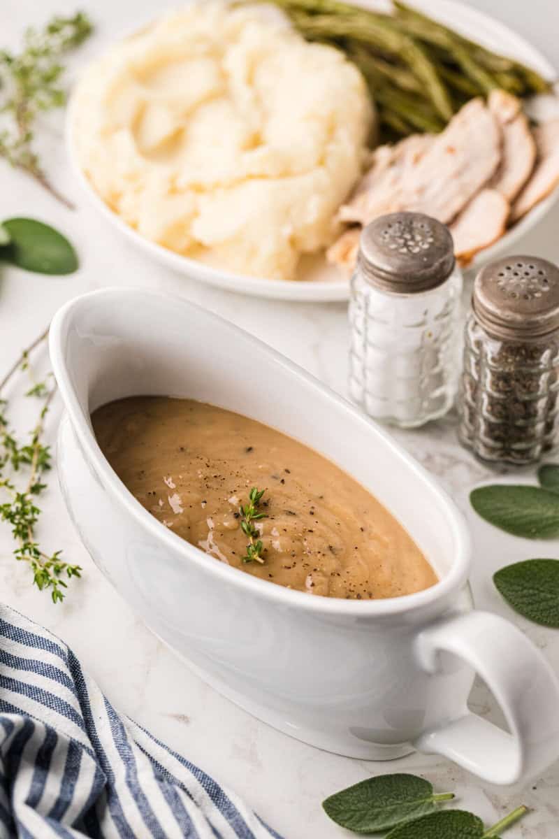 homemade gravy in a white saucer for serving.