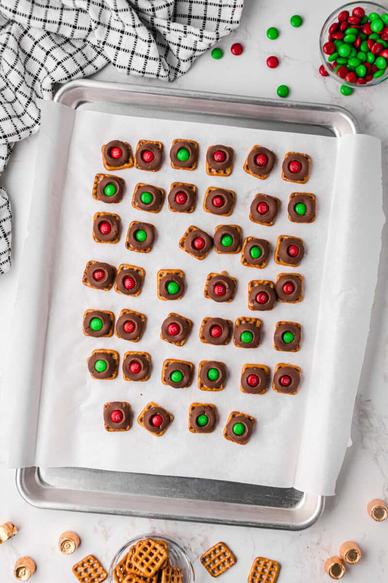pressing an M&M on top of each Rolo candy.