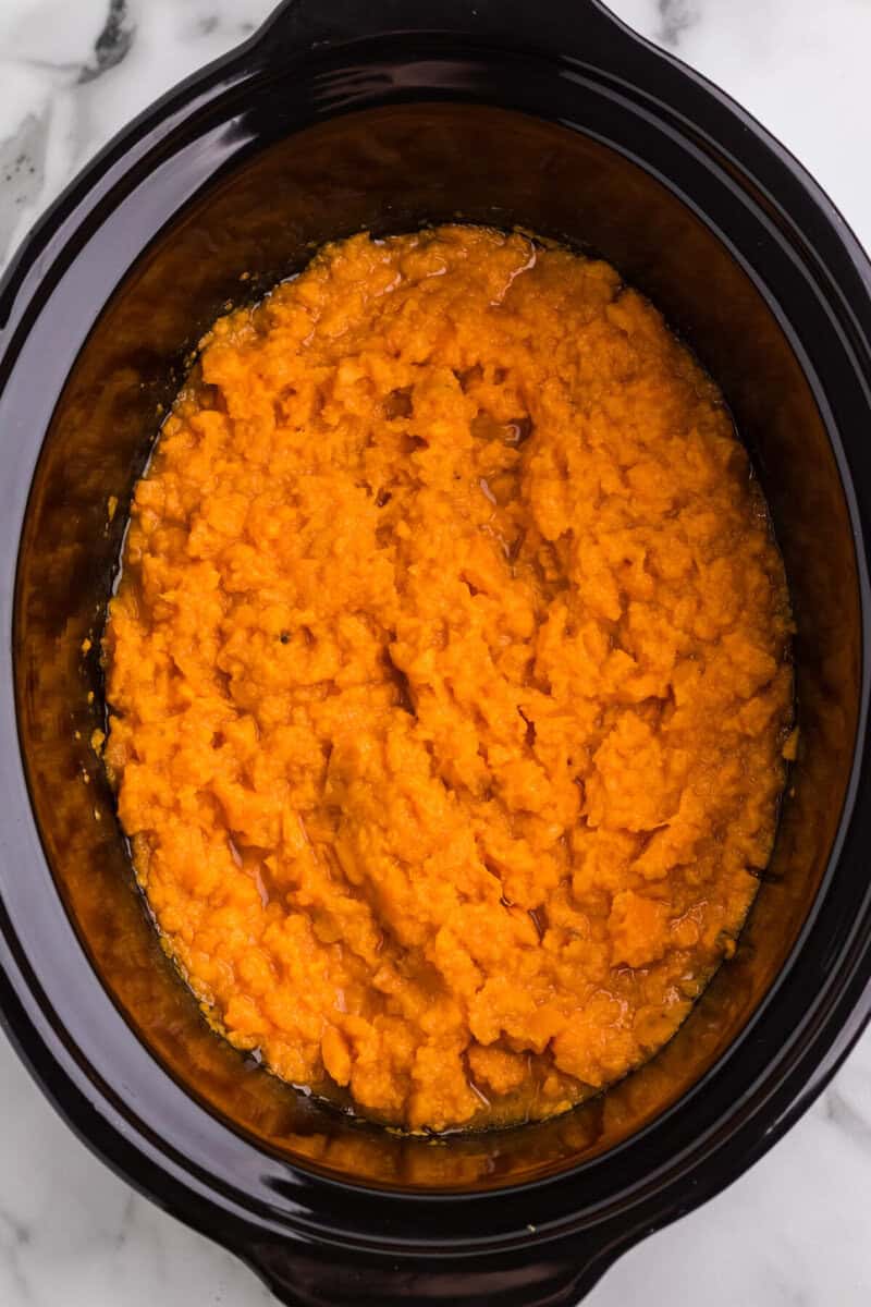 sweet potatoes cooked and mashed in the slow cooker.