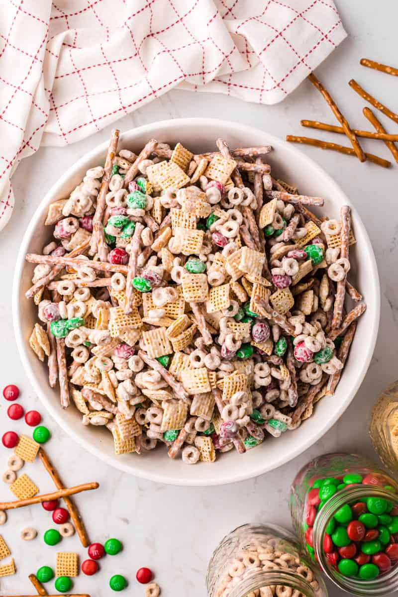 Christmas Chex Mix served in a large white bowl.