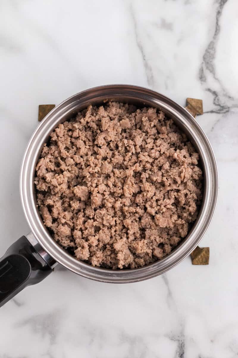 cooked sausage in a pan for the soup.