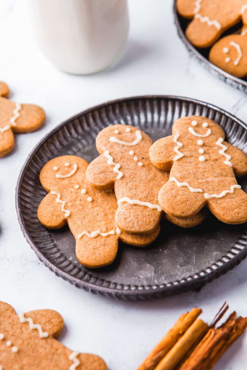 closeup of a a plate of 3 gingerbread cookies.