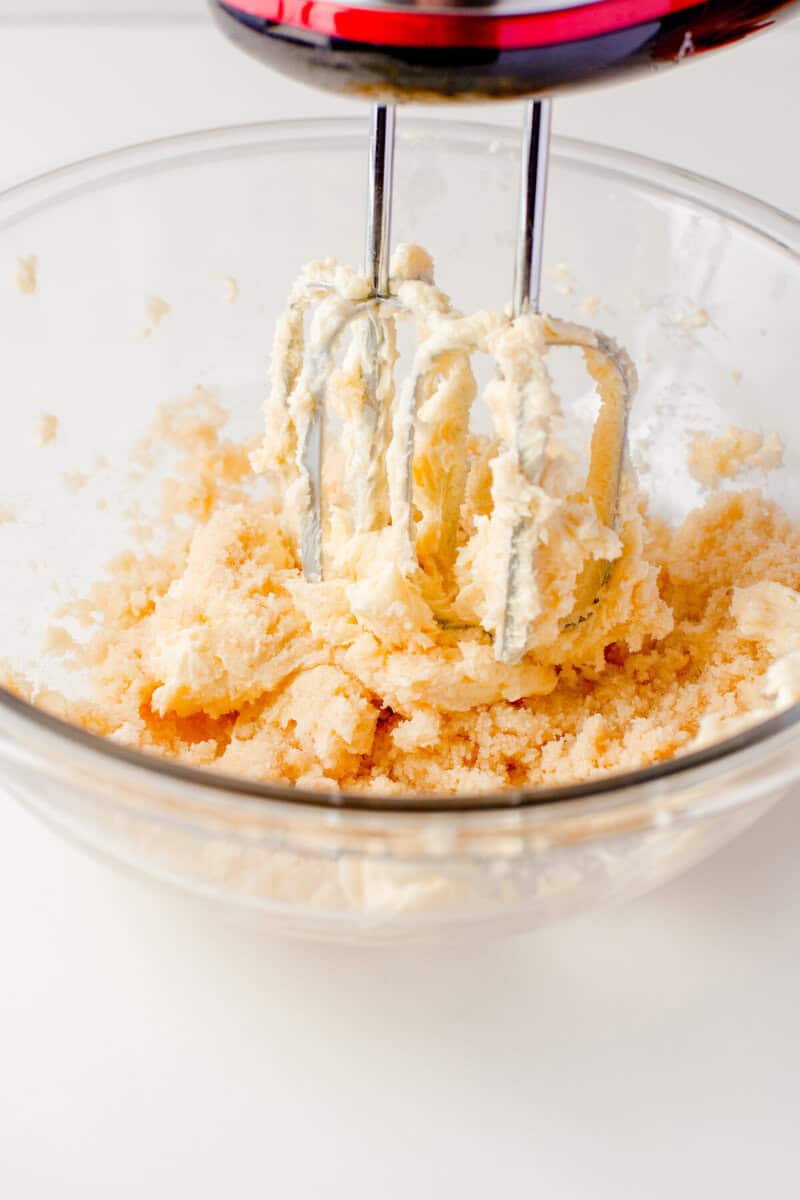 mixing together the butter and sugar.