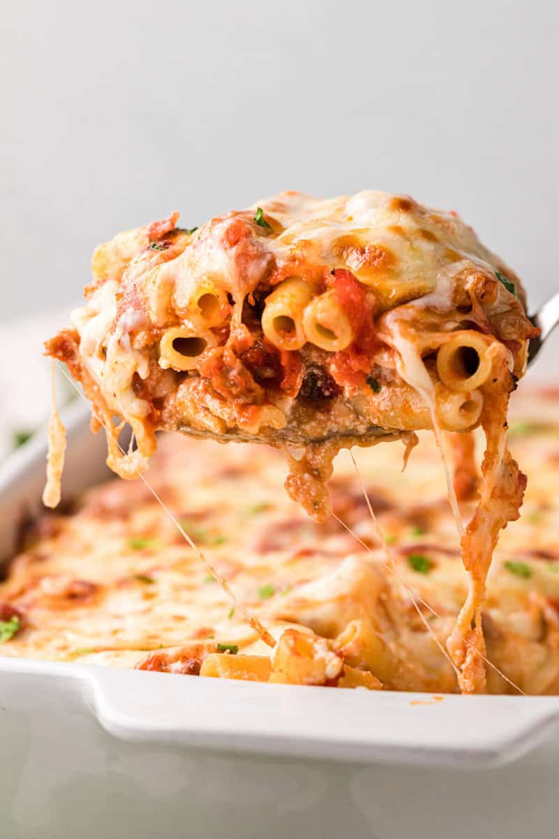 serving spoon with a scoop of the Baked Ziti on it.