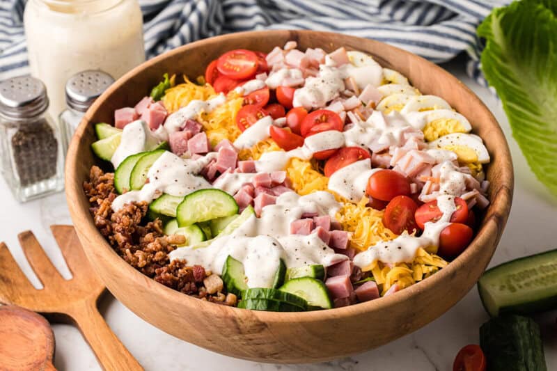 large wooden bowl with the Chef Salad in it.